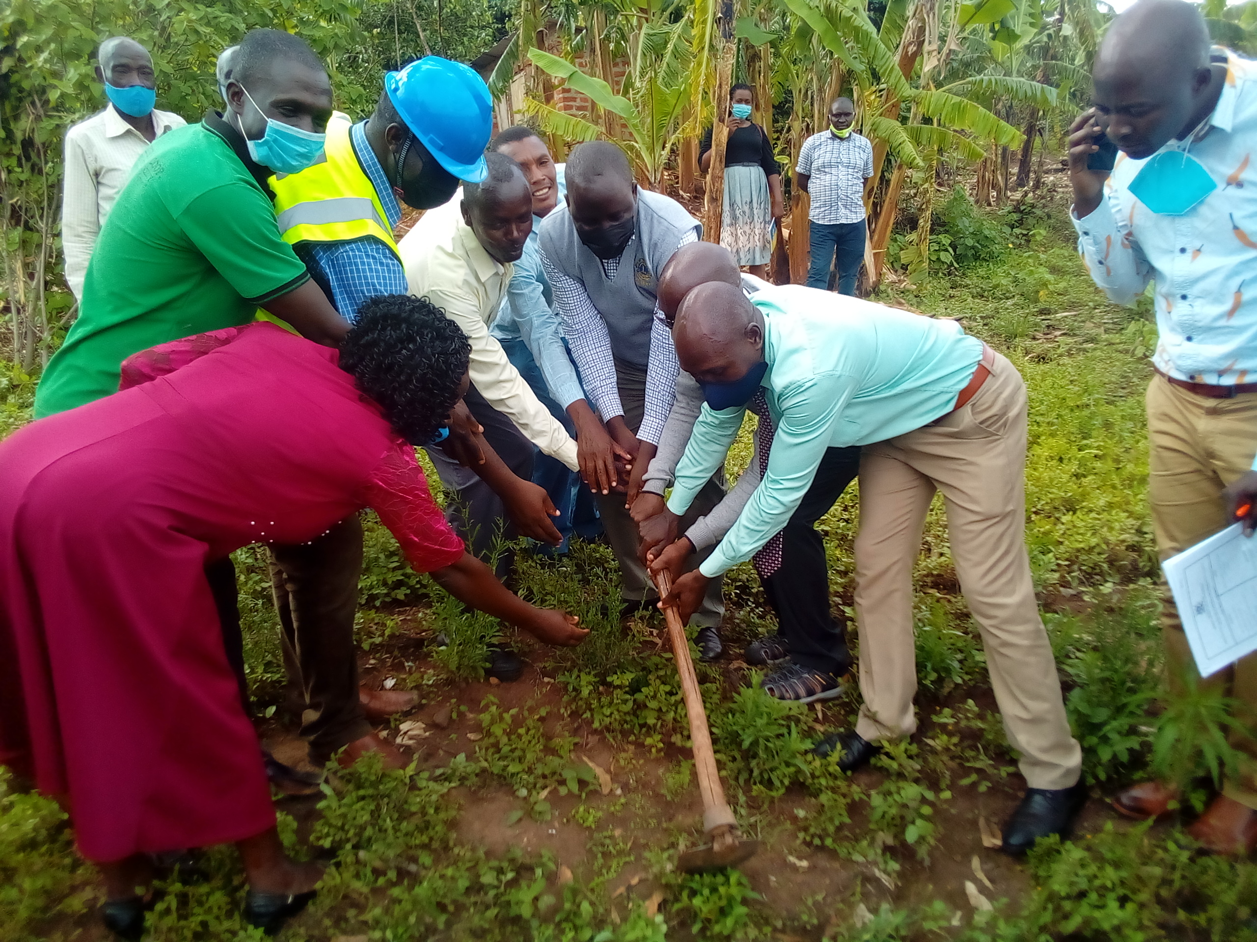 Happy Mayanja Chairman, CAO Ruhemba and other leaders at ground breaking for construction of a latrine at Kashozi market